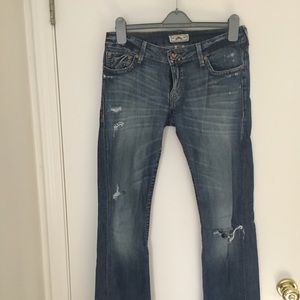 Prvcy distressed low on hip jeans.